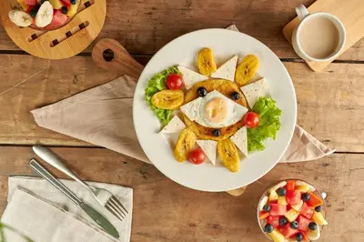a plate of food with an egg on top at Genesis Hotel in Sincelejo