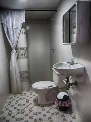 a bathroom with a toilet and a sink at Casa Hotel Nurandy in Cartagena de Indias