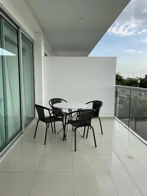 a patio with a table and chairs on a balcony at Apartamento Cartagena Morros Epic 25 in Cartagena de Indias