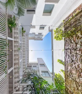 a view from the courtyard of a building with plants at Delirio Hotel in Cartagena de Indias