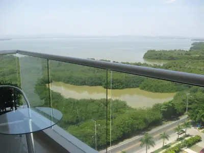 a view from the top of a building with a glass table at Cartagena Beach Front Apartments in Cartagena de Indias
