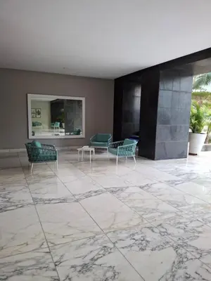 a living room with a marble floor and chairs at Cartagena Beach Condo - 1400 sq. Ft. (130 m2) in Cartagena de Indias