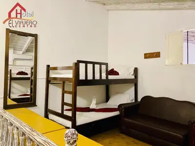 a living room with two bunk beds and a couch at Hotel El Viajero Centro in Cartagena de Indias