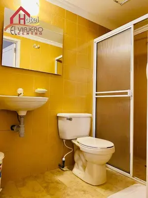a bathroom with a toilet and a sink at Hotel El Viajero Centro in Cartagena de Indias