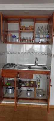 a small kitchen with a sink and a stove at Apartamento 1101 Edificio Nuevo Conquistador in Cartagena de Indias