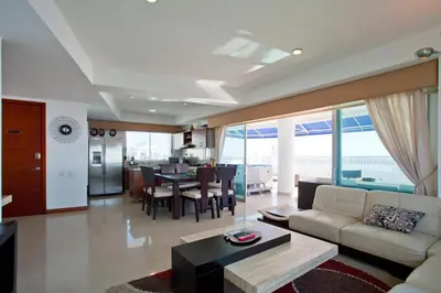 a living room with a couch and a table at Palmetto Penthouse Deluxe Beautiful view and sunset floor 39 in Cartagena de Indias