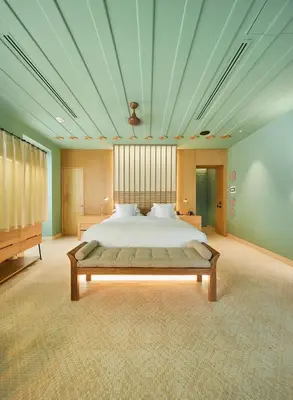 a large bedroom with a bed and a blue ceiling at Hotel Boutique Casona del Colegio in Cartagena de Indias