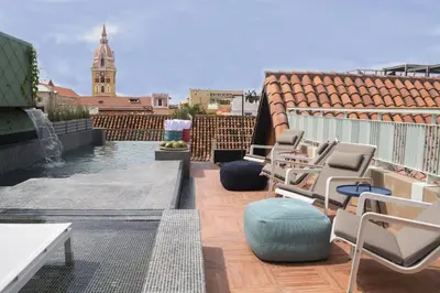 a row of chairs sitting on a roof at Hotel Boutique Casona del Colegio in Cartagena de Indias