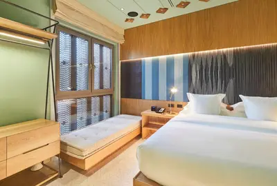 a bedroom with a large bed and a window at Hotel Boutique Casona del Colegio in Cartagena de Indias