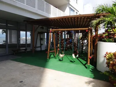 a swing set on the side of a building at Mi Apartamento en Cartagena in Cartagena de Indias