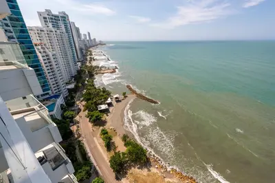 an aerial view of the beach in front of a building at MURANO ELITE NEW OCEAN FRONT DUPLEx in Cartagena de Indias
