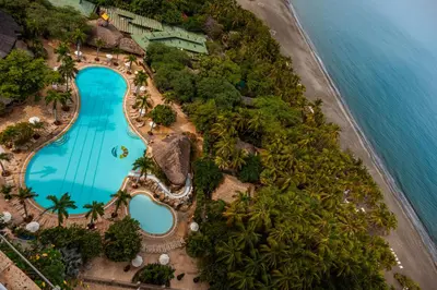 an aerial view of the pool at a resort next to the ocean at Hotel Irotama Lago in Santa Marta