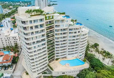 an aerial view of a tall building with a swimming pool at Hotel Irotama del Sol in Santa Marta