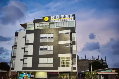 a building with a hotel sign on top of it at Hotel La Esperanza in Cartagena de Indias