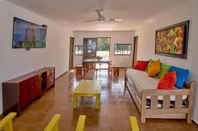 a living room with a couch and a table at Cabaña El Refugio in San Antero