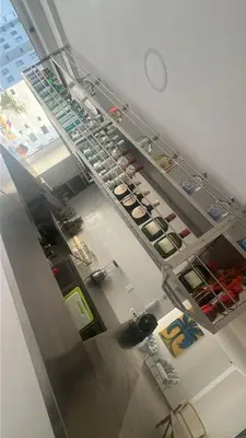 a room with a shelf with food on it at Hotel Hernández CTG in Cartagena de Indias