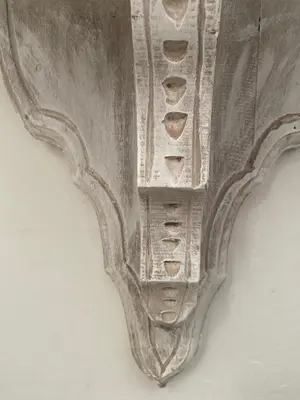 a metal object is hanging on a wall at Balcones de Venecia in Cartagena de Indias