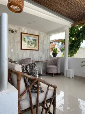 a living room with a chair and a table at Balcones de Venecia in Cartagena de Indias