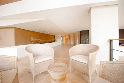 a living room with two chairs and a table at Cielo Mar Regatta - LivinColombia in Cartagena de Indias