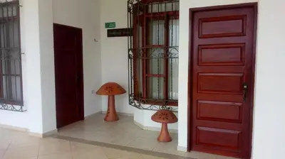 a room with two mushrooms next to a door at Hotel Brisas del Mar San Antero in San Antero