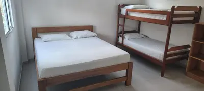a room with two bunk beds in a room at Condominio bahia blanca in Coveñas