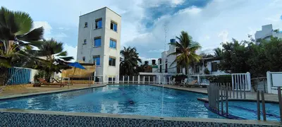 a large swimming pool in front of a building at Condominio bahia blanca in Coveñas