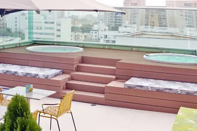 a building with two hot tubs on a roof at Hampton by Hilton Barranquilla in Barranquilla