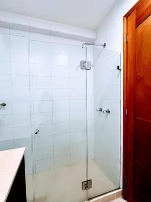 a shower with a glass door in a bathroom at Apartamento en cartagena Boquilla vista al mar dos Hab in Cartagena de Indias