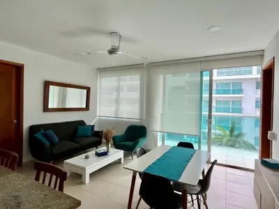a living room with a couch and a table at Apartamento en cartagena Boquilla vista al mar dos Hab in Cartagena de Indias