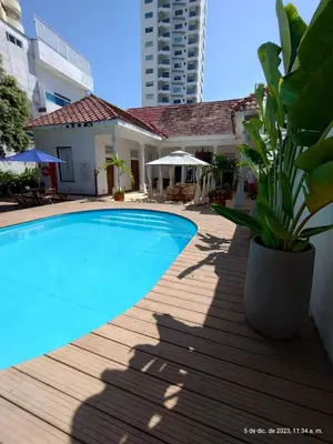 a swimming pool in front of a house at Casa Bustamante Hotel Boutique in Cartagena de Indias