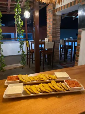 a tray of food sitting on a table with food at Hotel Puerto Colombia in Puerto Colombia