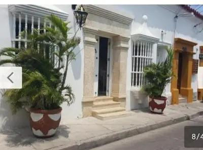 two large potted plants in front of a house at Casa Francia in Cartagena de Indias