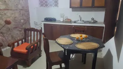 a kitchen with a table with fruit on it at Casa Francia in Cartagena de Indias