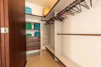 a walk in closet with a wooden door at Edificio Morros Vitri Lujo con Panorama in Cartagena de Indias