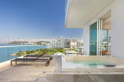 a bathroom with a tub and a view of the ocean at Santa Marta Marriott Resort Playa Dormida in Santa Marta