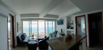 a living room with a view of the ocean at palmetto frente al mar in Cartagena de Indias
