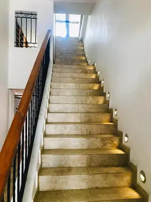 a staircase in a house with concrete stairs and a railing at Calle de la iglesia 35-59 in Cartagena de Indias