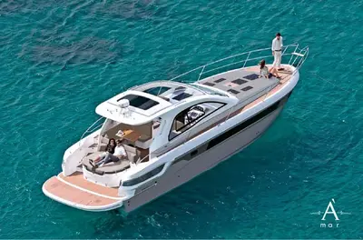 a man standing on top of a boat in the water at Cartagena Morros playa edificio frente al mar 1 in Cartagena de Indias