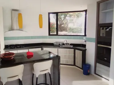 a kitchen with a counter and a sink and a window at Casa en Santa Veronica Atlantico in Santa Veronica