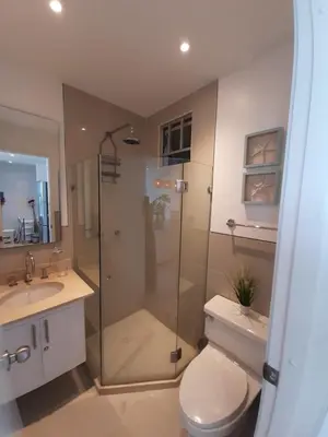 a bathroom with a shower and a toilet and a sink at Apartamento en Cartagena primera linea de Playa Morros Epic in Cartagena de Indias