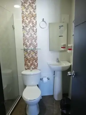 a bathroom with a toilet and a sink at Ocean blue Ed Conquistador in Cartagena de Indias