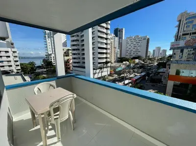 a small table and two chairs on a balcony with a city at Vista Al Mar, Aire Acondicionado en Todo el Apto, Wi-Fi, Parqueadero in Cartagena de Indias