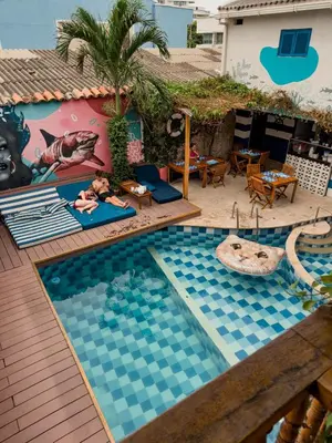 a pool at a resort with two babies in it at Casa del Puerto Hostel & Suites in Cartagena de Indias