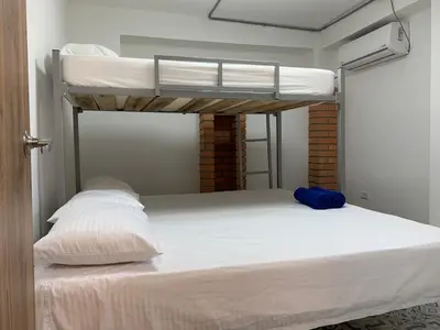 a bedroom with two bunk beds in a room at Casa de la Cruz Centro Historico in Cartagena de Indias