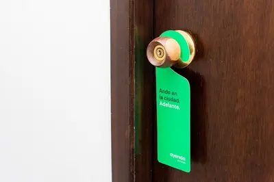 a door with a green door tag on it at Hotel Ayenda Cartagena Blue 1804 in Cartagena de Indias