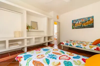 a bedroom with two beds and a window at JUNTO AL MAR Y EL MANGLAR in Cartagena de Indias