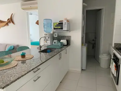 a kitchen with a counter with a sink and a microwave at Cartagena Morros 3 Playa in Cartagena de Indias