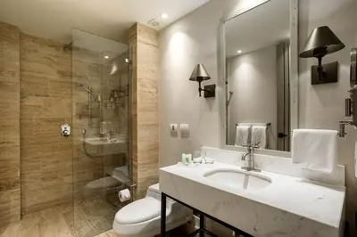 a bathroom with a sink and a toilet and a shower at Eurostars Marqués de Villalta in Cartagena de Indias