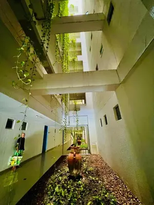a hallway with a vase in the middle of a building at MORROS EPIC luxury in Cartagena de Indias