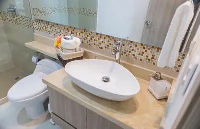 a bathroom with a white sink and a toilet at Modern 1BR WiFi Breathtaking Oceanviews by Huespedia in Cartagena de Indias